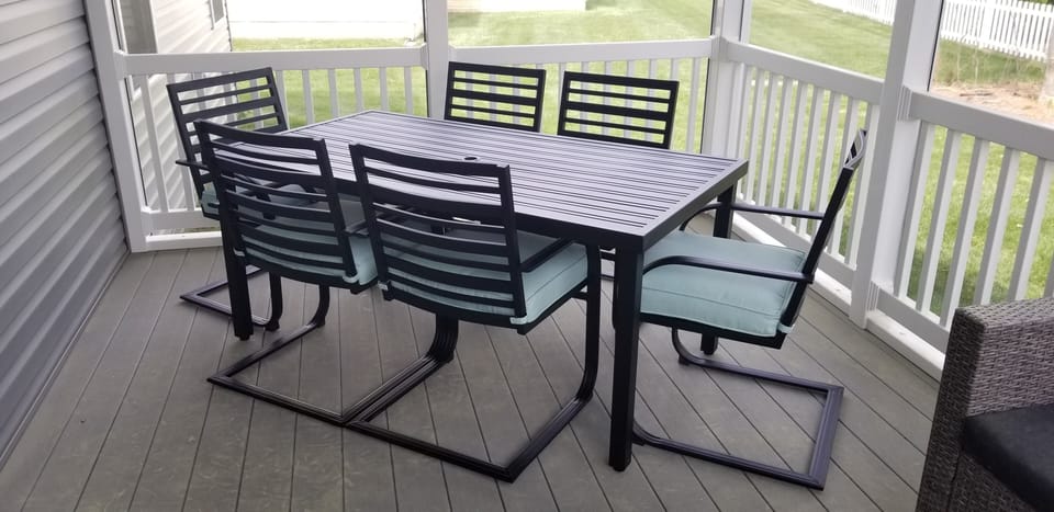 Dining table on screened porch.  No mosquitoes invited to dinner!
