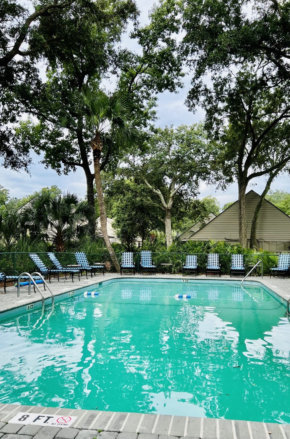 Private neighborhood fenced in pool with bathrooms. Just behind our villa.