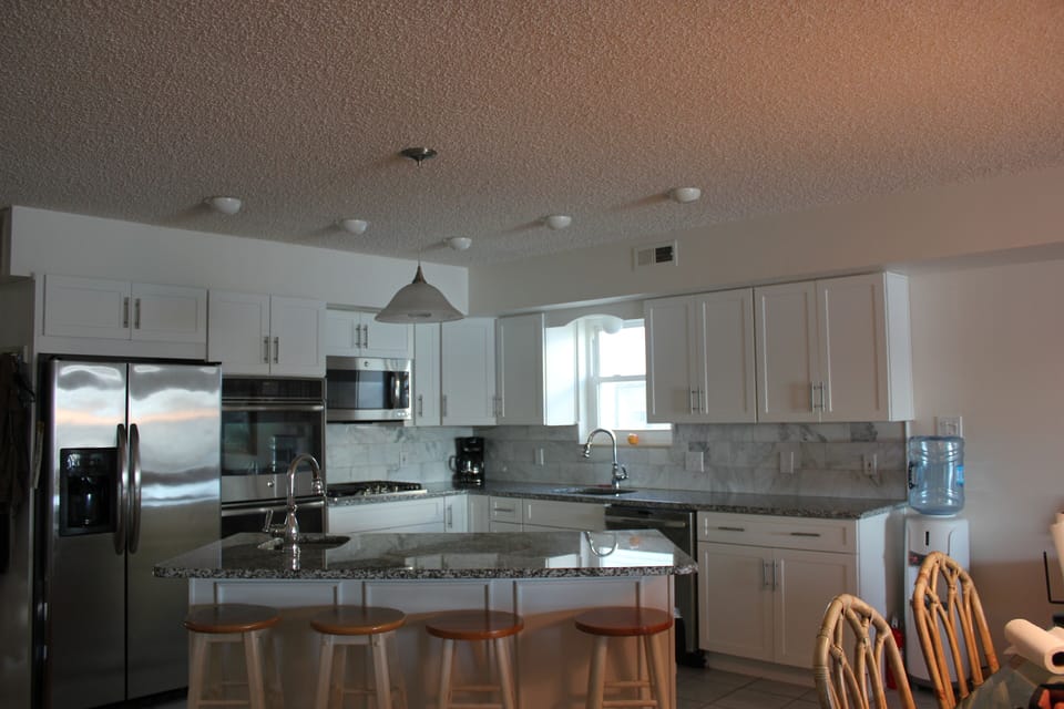 New kitchen--gas stovetop, double wall ovens, two sinks