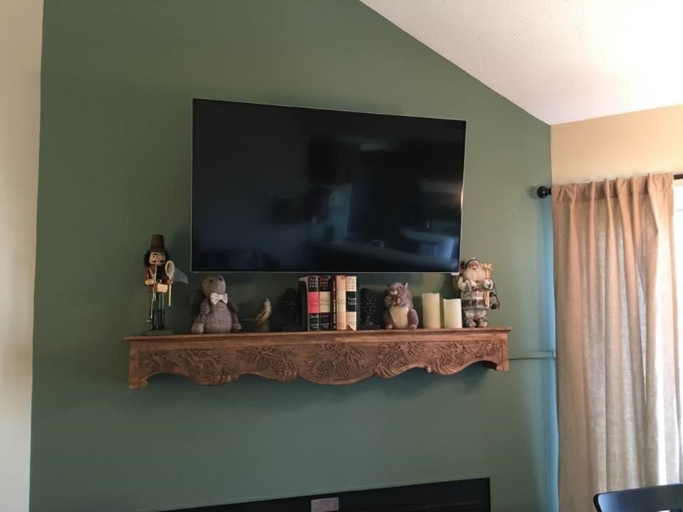 Smart TV with Netflix and basic cable. Swivel wall mount.