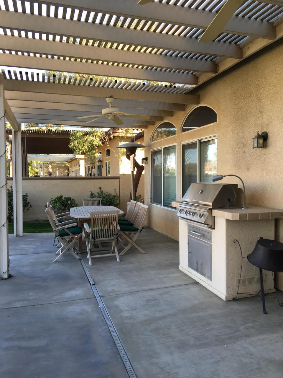 Outside patio with built in BBQ and table with seating for 10