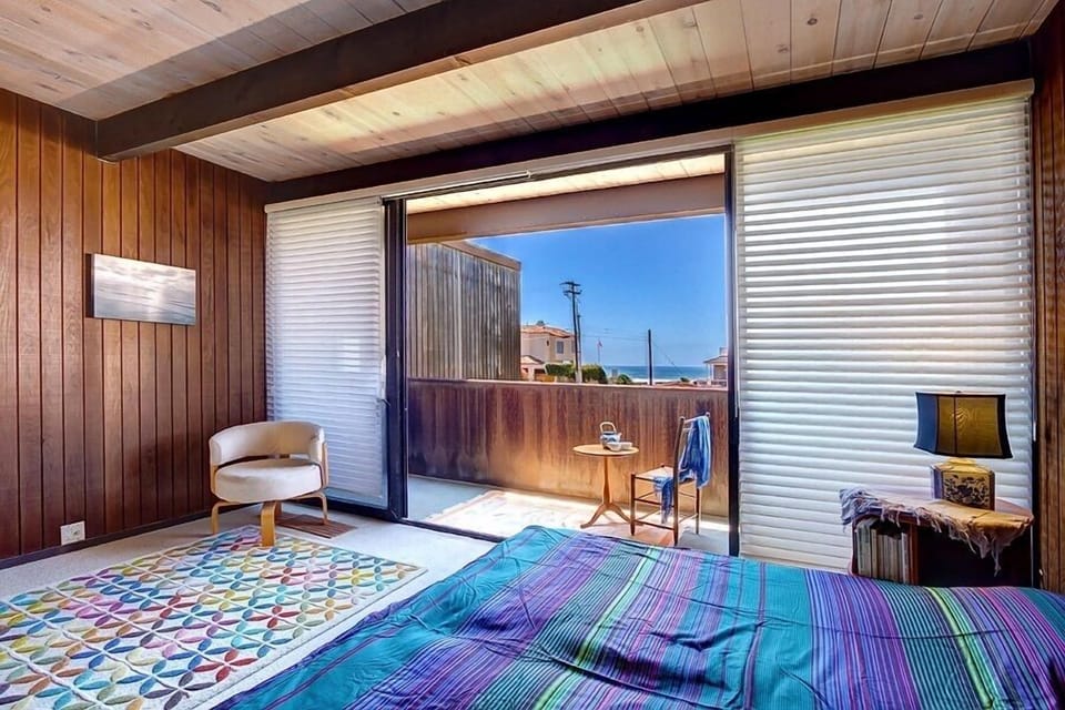 Master bedroom with balcony and ocean view