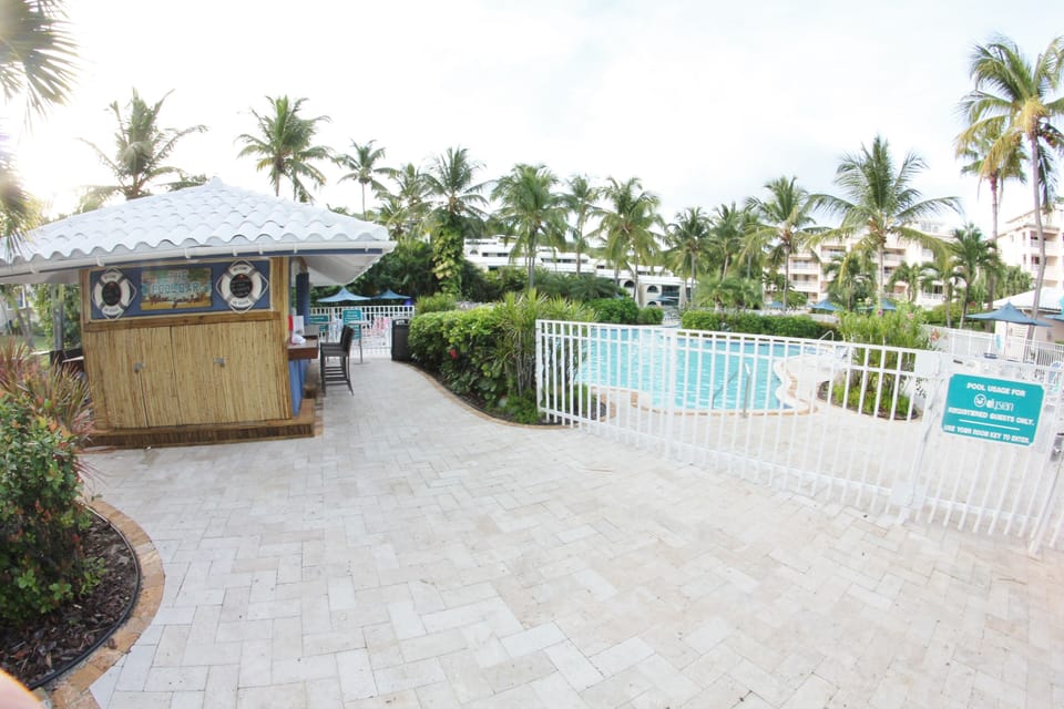enjoy drinks and food at pool bar