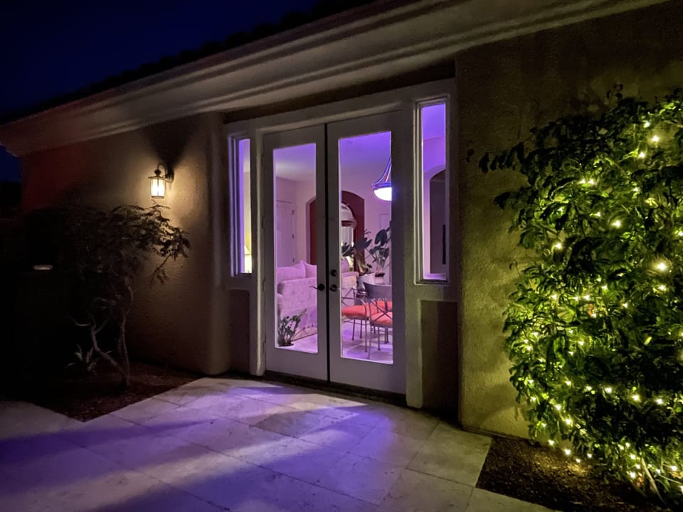 DINING ROOM with French doors with view of side yard garden