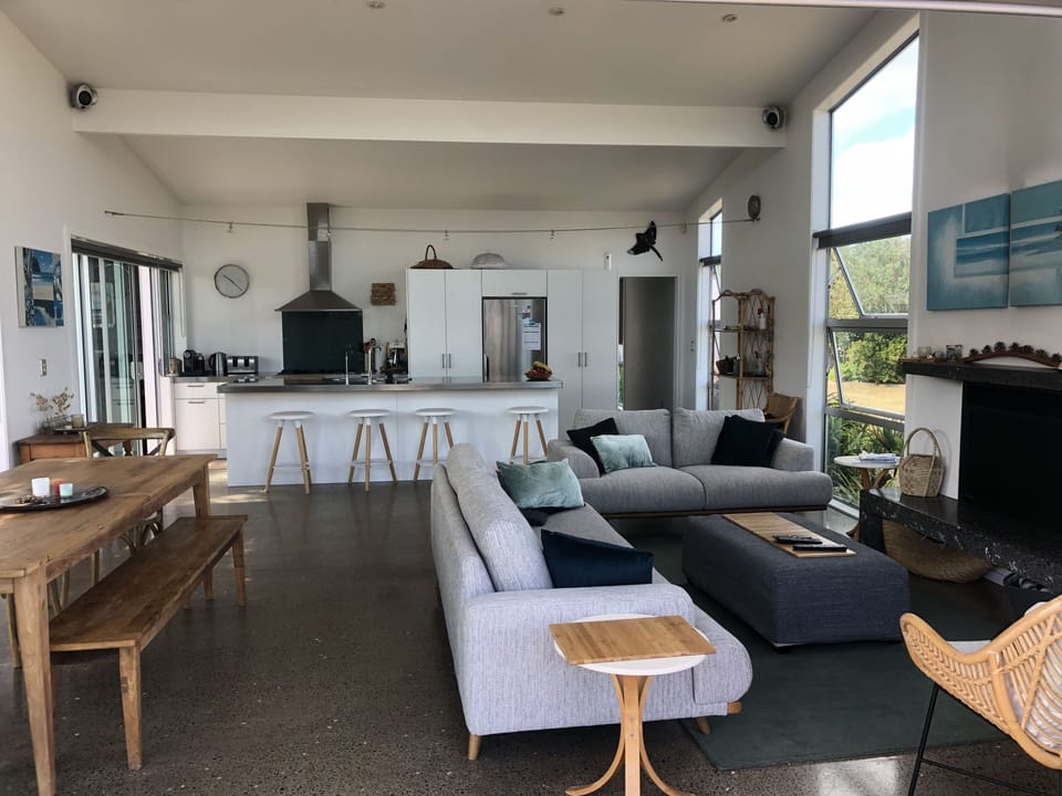 Downstairs kitchen, dining and lounge flowing to outdoors