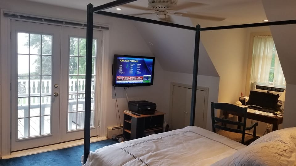 Master bedroom with doors to deck