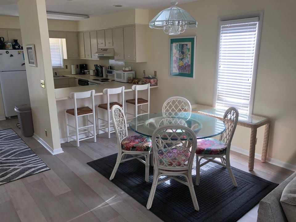 Seating for 7, newly upholstered dining set, new rugs throughout house