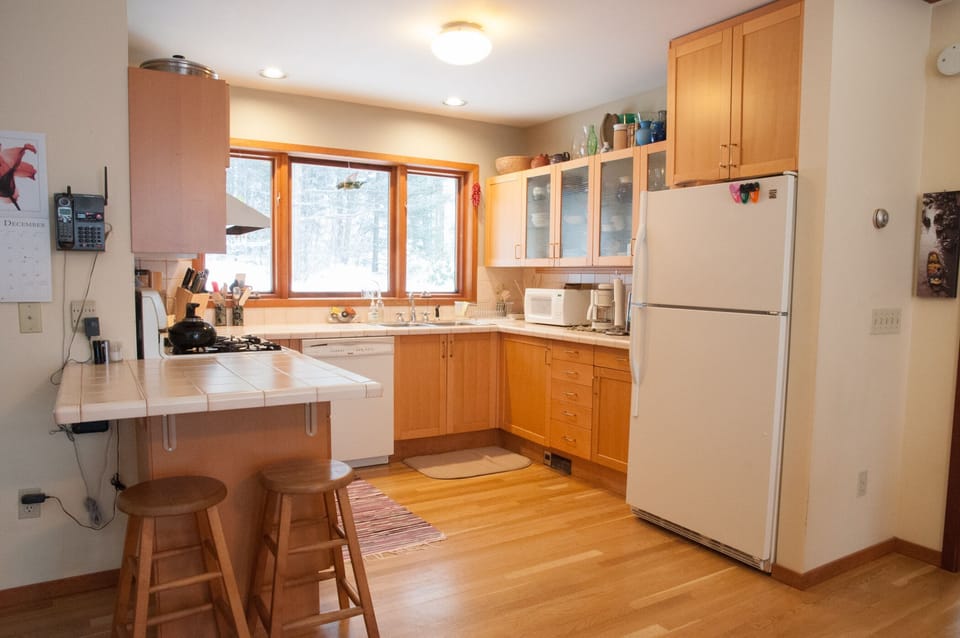 fully supplied kitchen, open to the dining and living area