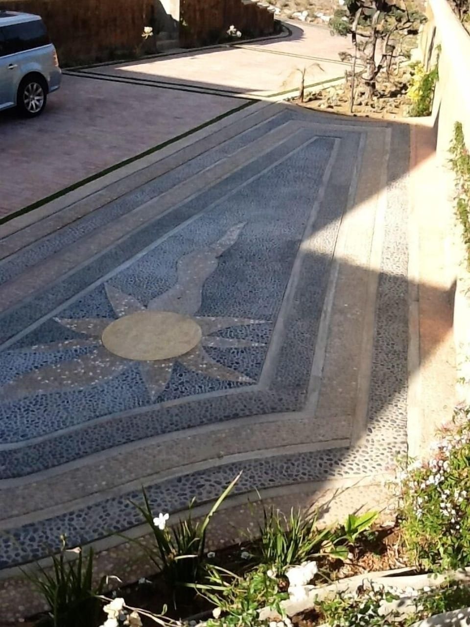 Mosaic driveway with personal property