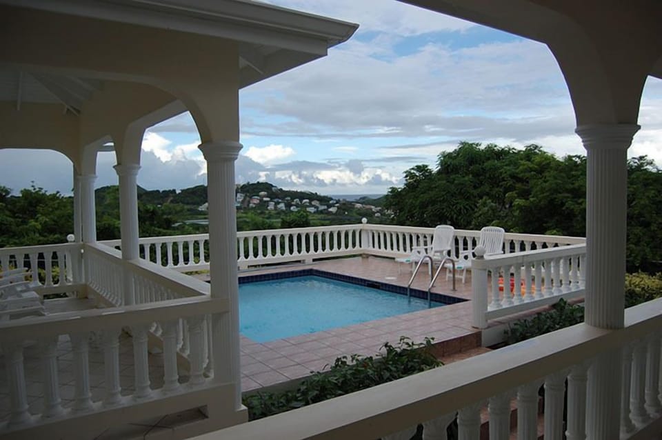 Sunbathe on the pool deck or relax in the balcony next to the pool