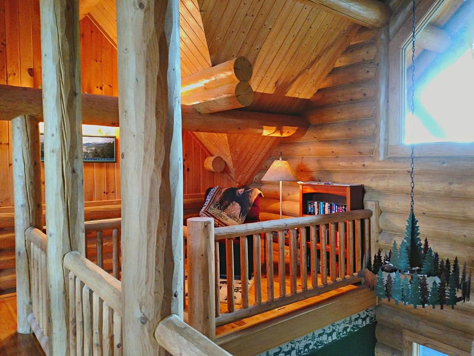 Upstairs reading nook with recliner and large selection of books