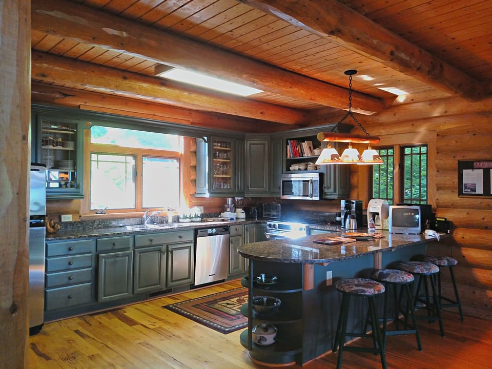 Very well appointed  kitchen with double ovens, granite, all pots/pans/dishes