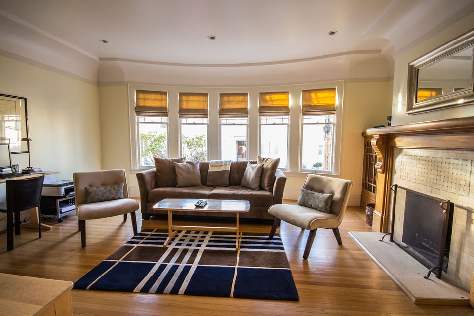 Lovely, comfortable living room with wood burning fireplace.