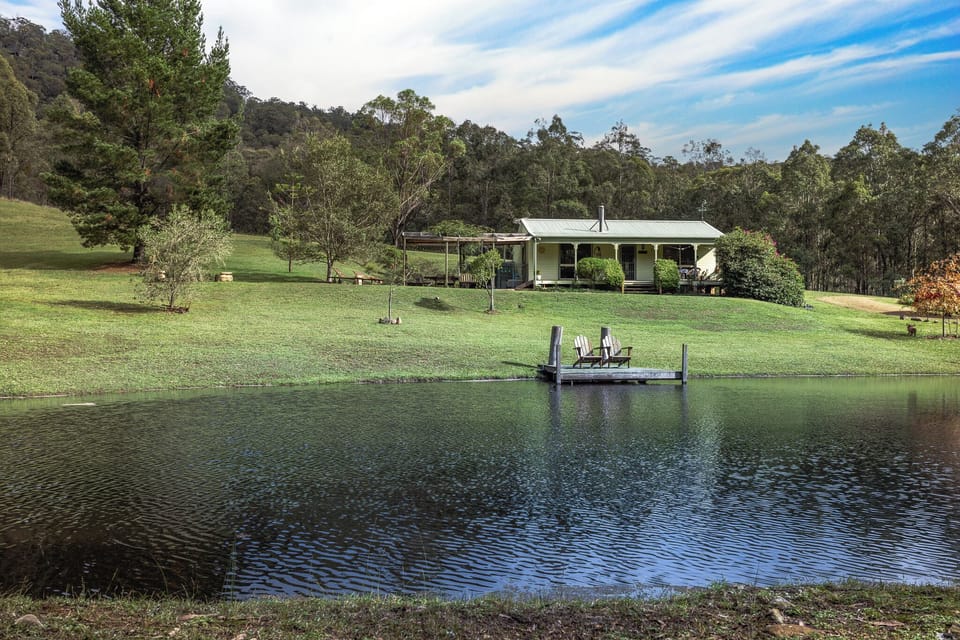 View across the full dam to the cottage