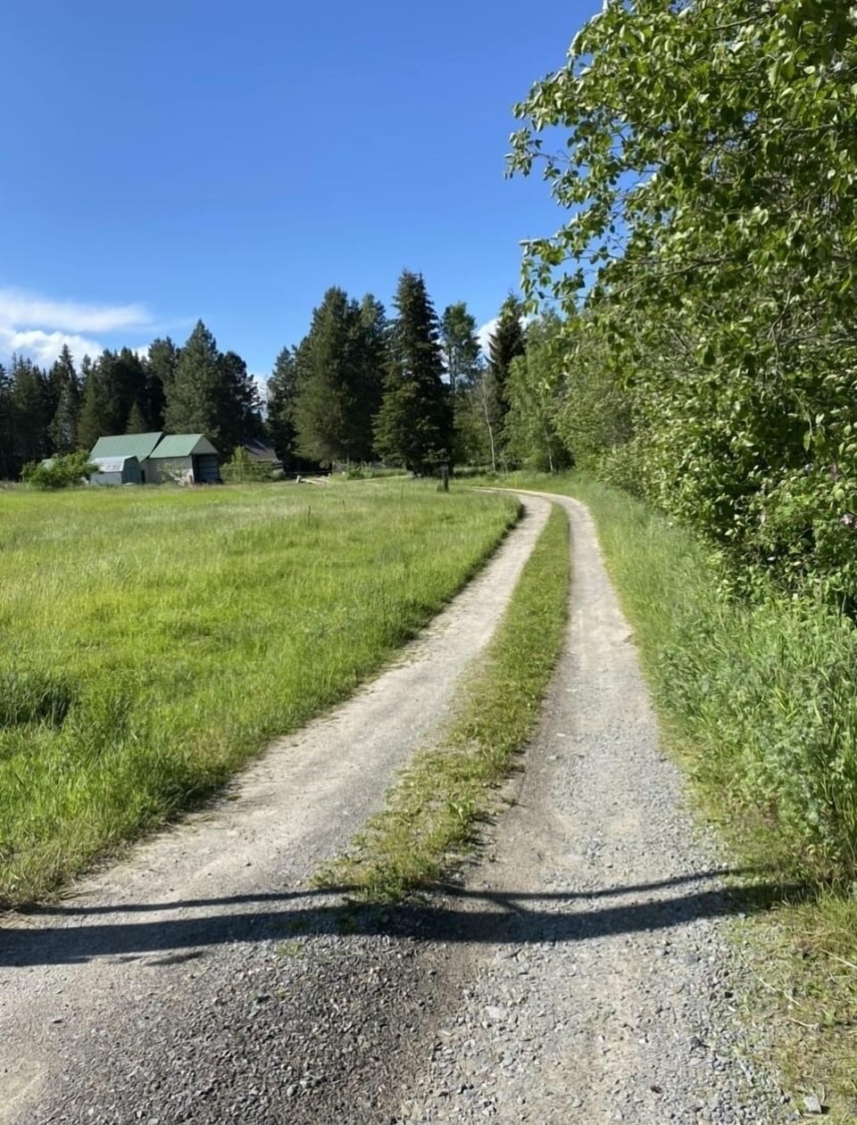 Through field, pass barn, stay left park at yellow marker