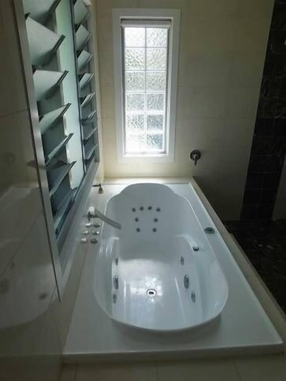 main bathroom with huge two person spa bath