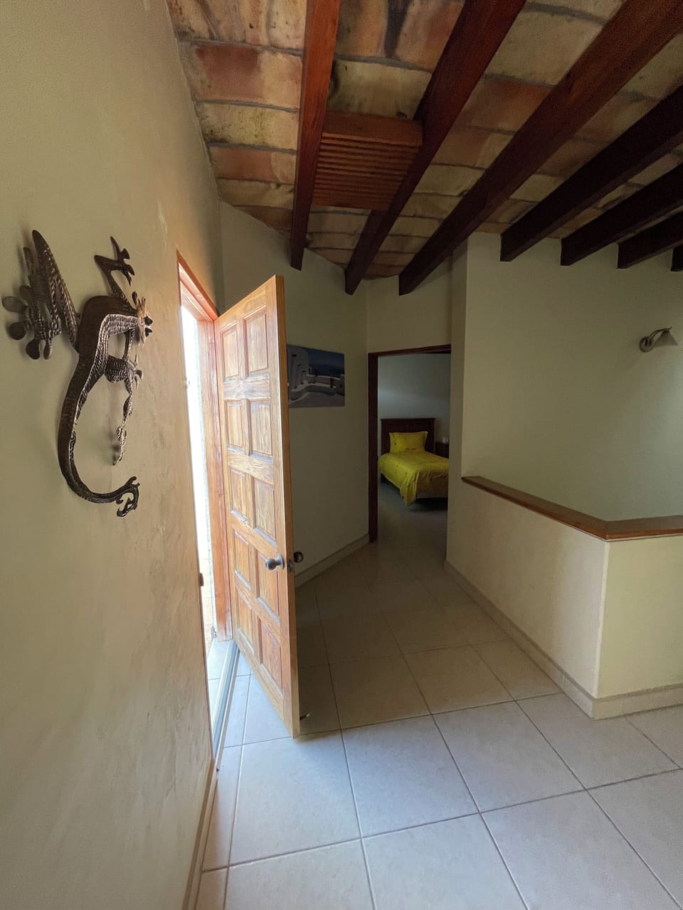 Upstairs, picture taken from master room to second bedroom, balcony to the left