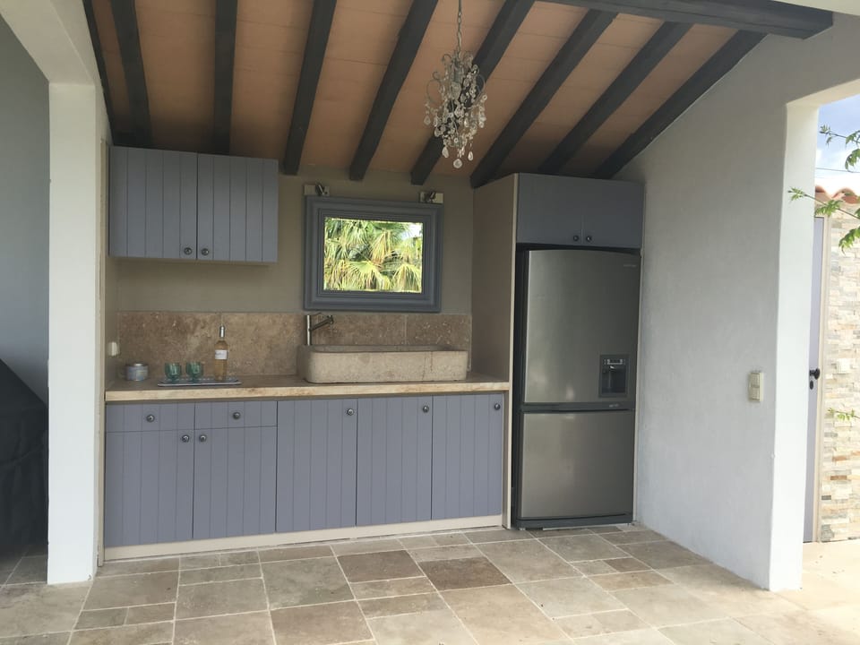 Outdoor kitchen with fridge and freezer for cold drinks and icecreams
