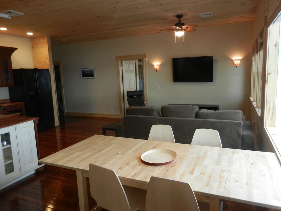 Kitchen table, living room, flat screen TV, cable, DVD Player