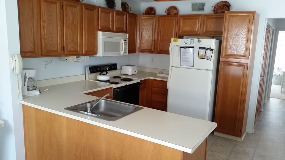 Fully stocked kitchen with all the utensils you will need .