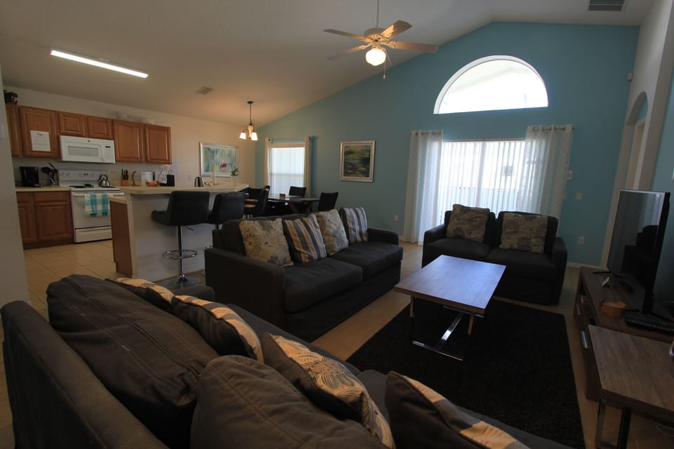A view of the main living space, showing part of the kitchen, left background