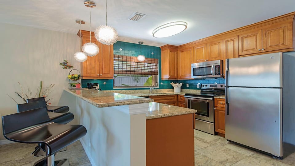 kitchen fully stocked with cookware and appliances