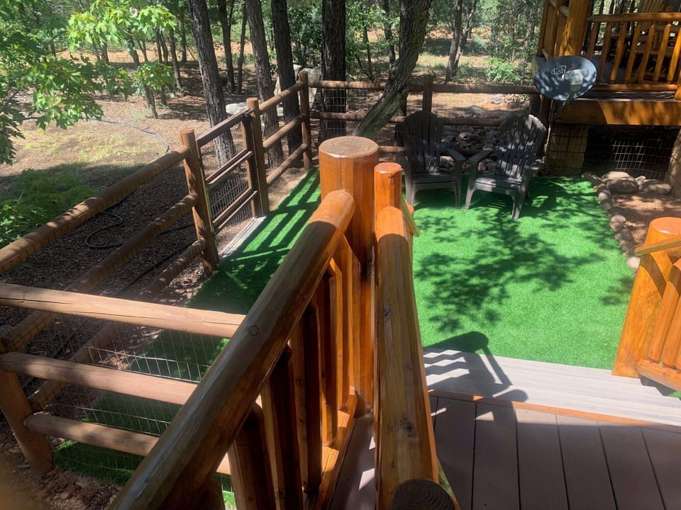 Keep an eye on the kids and pooches. in secured fenced area off of the deck