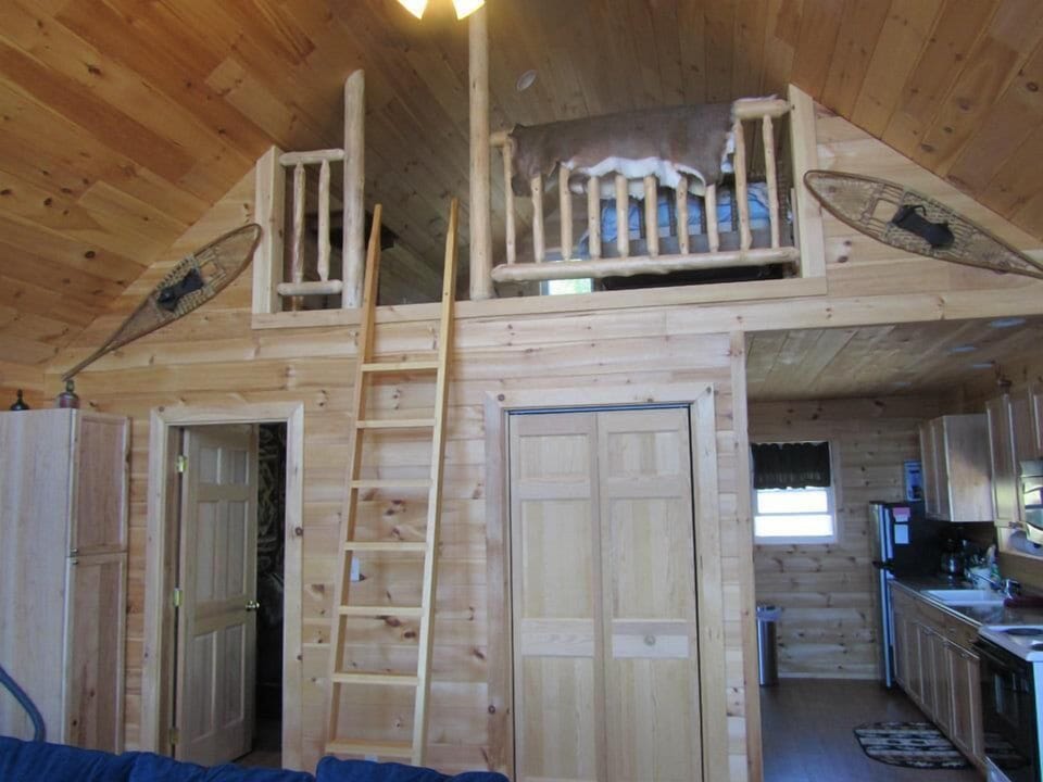 View of master bedroom, loft, and kitchen.