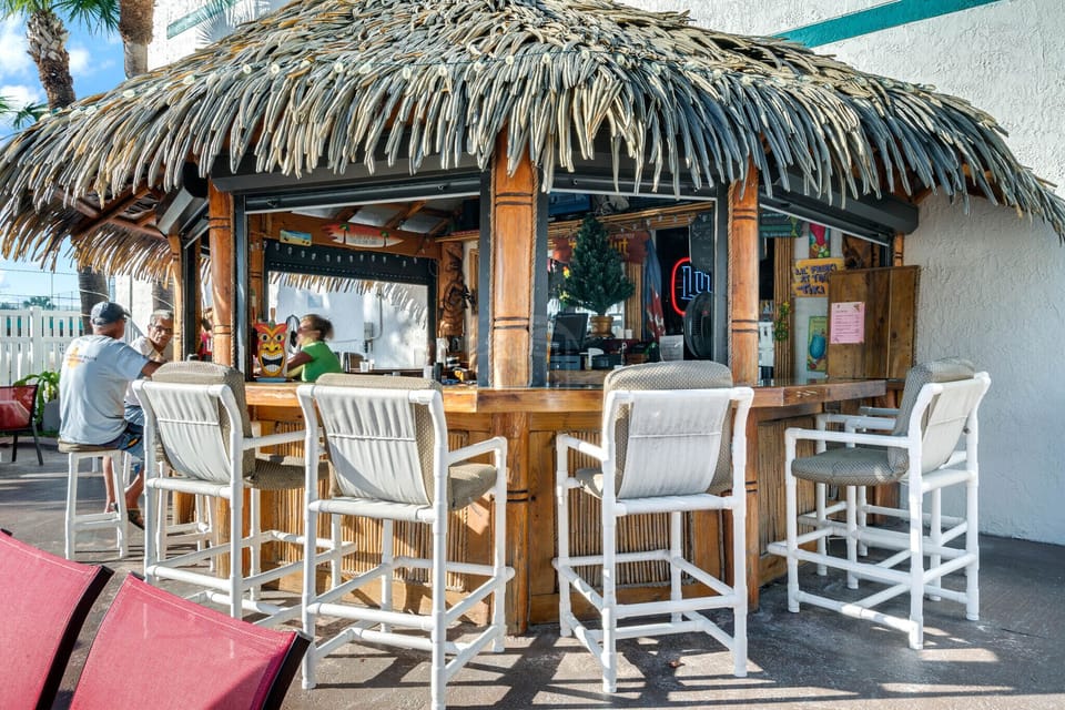 Enjoy food and drinks by the poolside
Tiki bar.