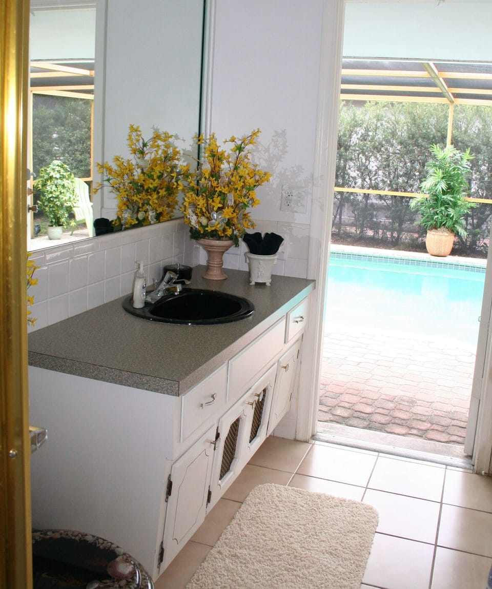 Cabana bath in second master suite is ideal for after pool showers