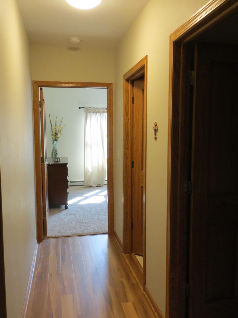 Hallway to 3rd bedroom. Storage and 3rd bath are on the right. 