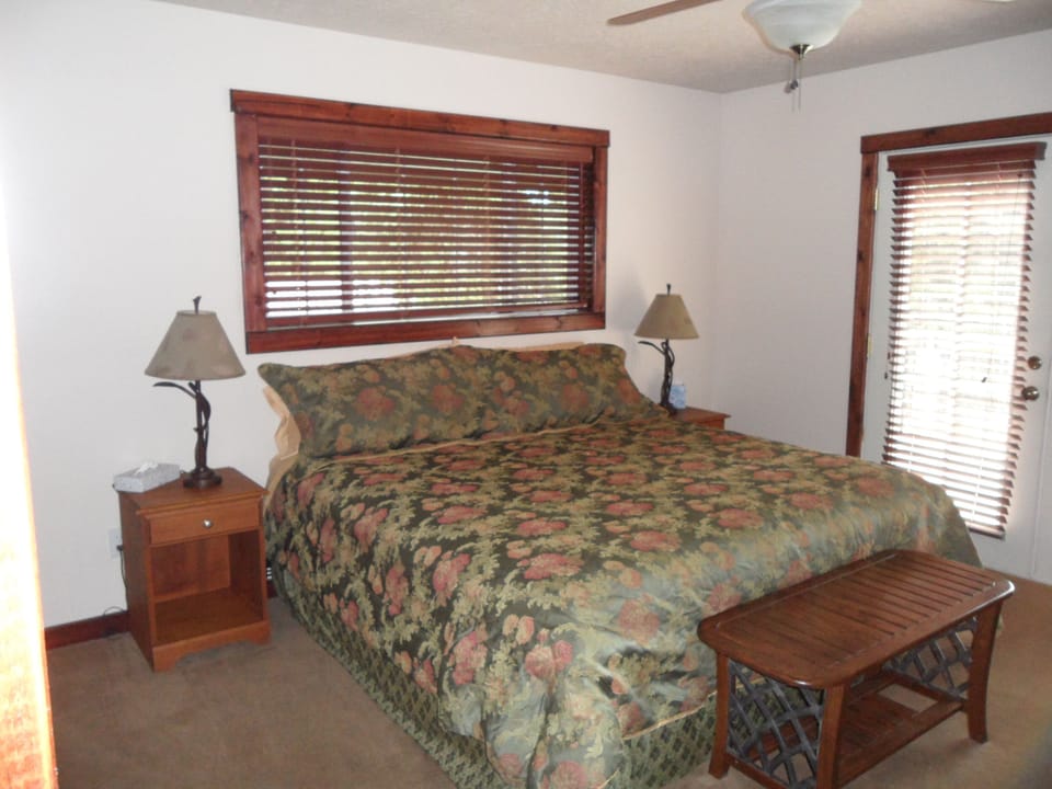 King bedroom with lake view deck