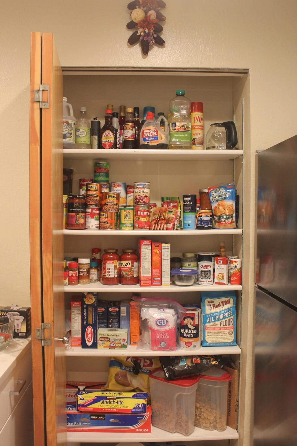 Kitchen pantry is fully stocked with supplies.