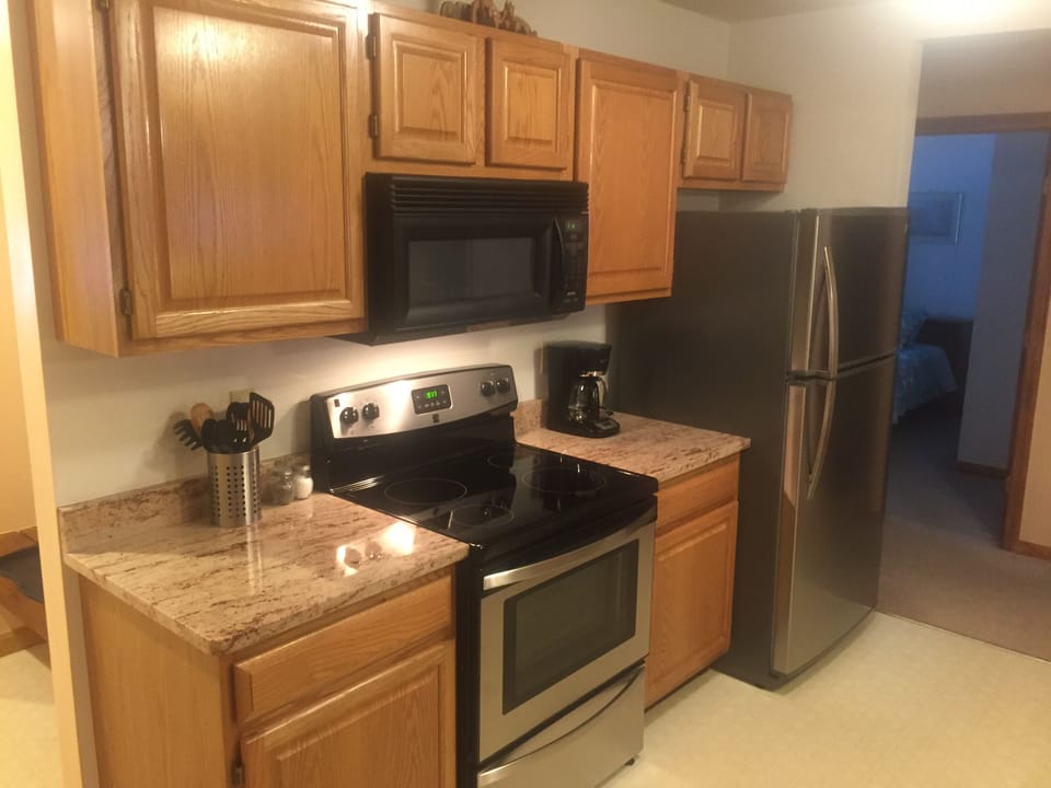 Kitchen with granite countertops and stainless steel appliances