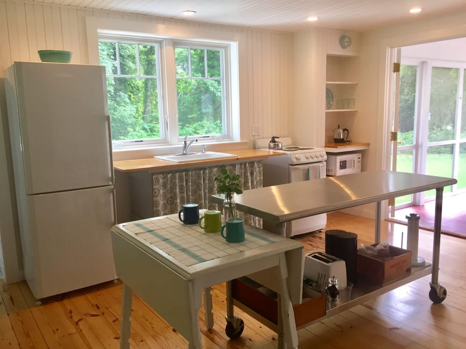 Cheery and light filled cottage kitchen with all the essentials.