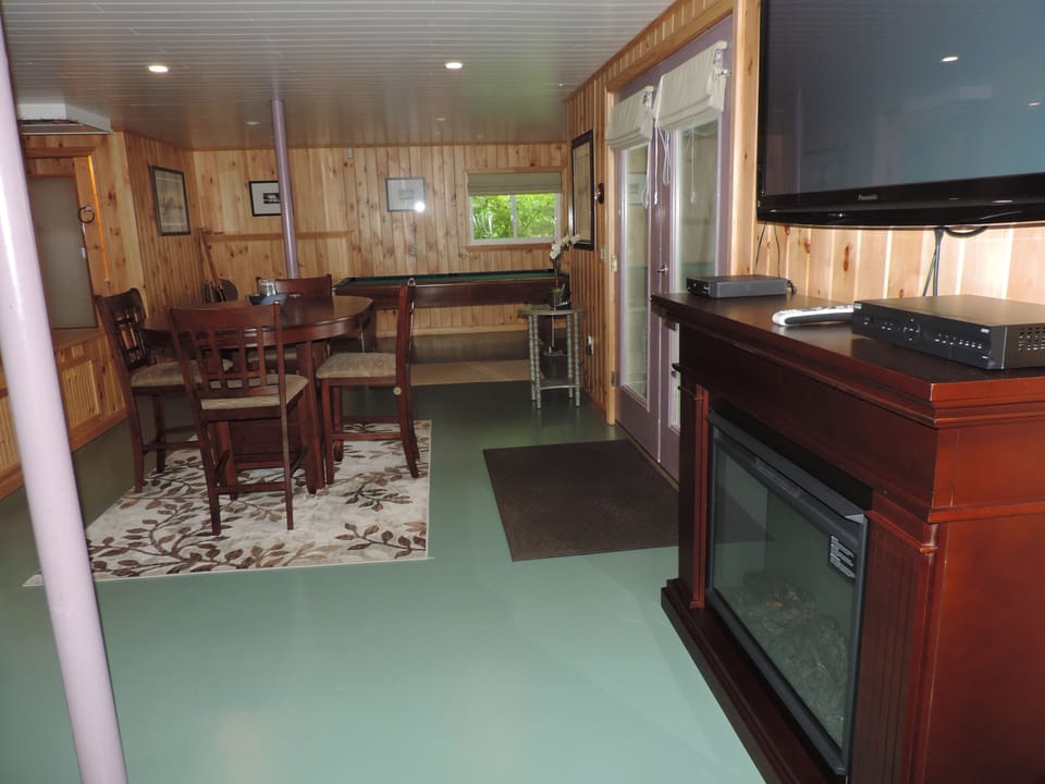 Lower level with pool table,50 inch flat screen TV and view of lake
