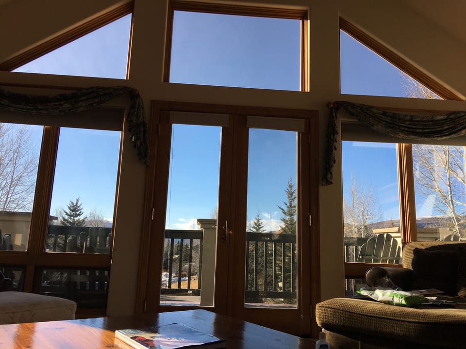 Great Room windows with views leading to sunset deck