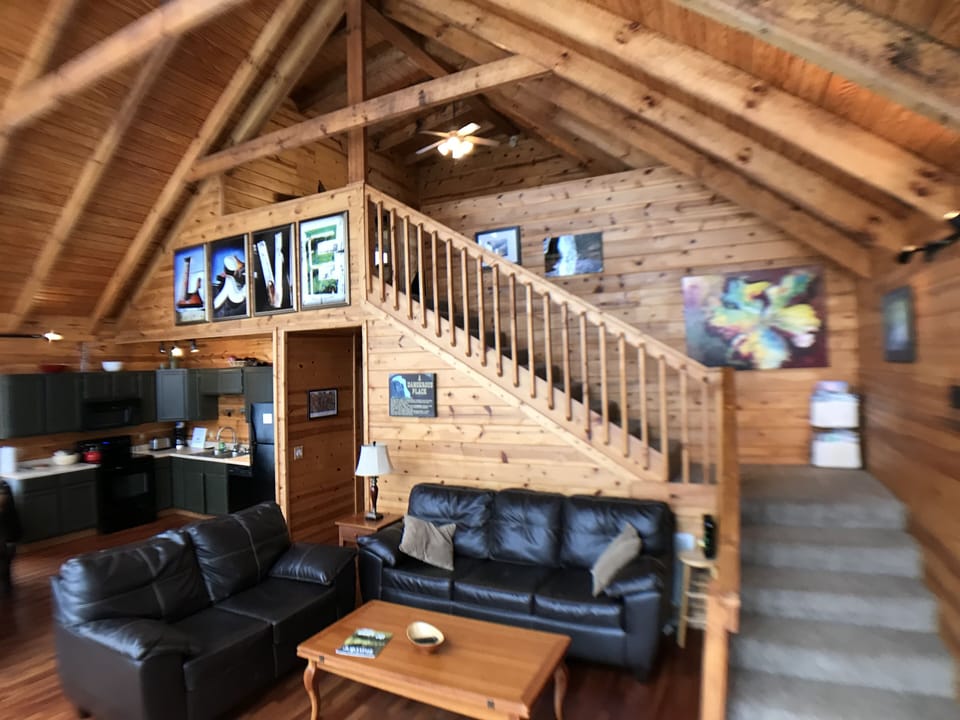 Living room, stairs leading to master bedroom