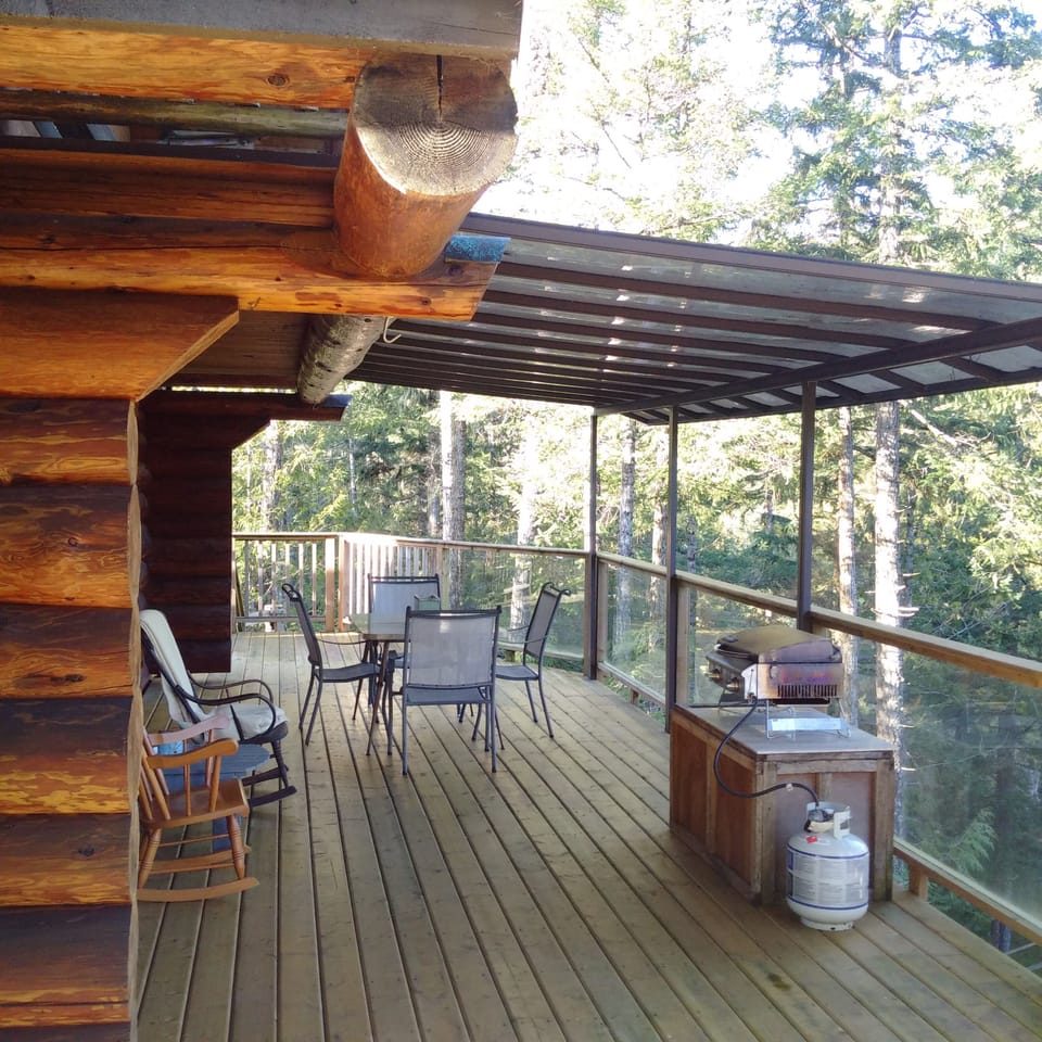 Covered bbq and eating area on massive wraparound deck