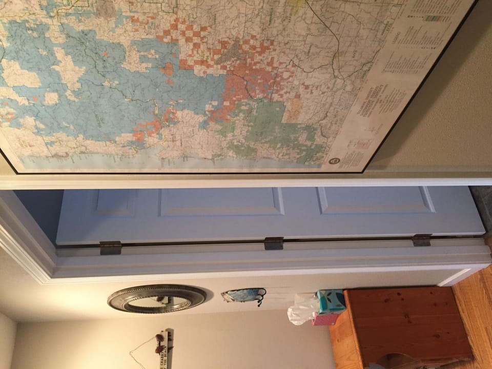 main floor hallway with coastal map