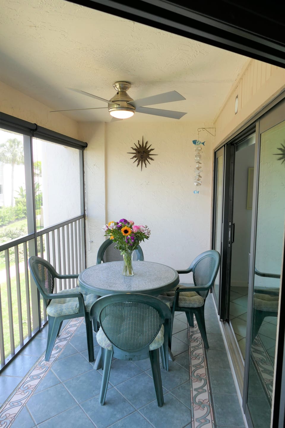 Lanai with sliding doors from living room and master bedroom, screened
