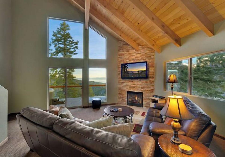 2nd Floor Den: Gas fireplace, rock hearth, mind-numbing views of Lake Tahoe.