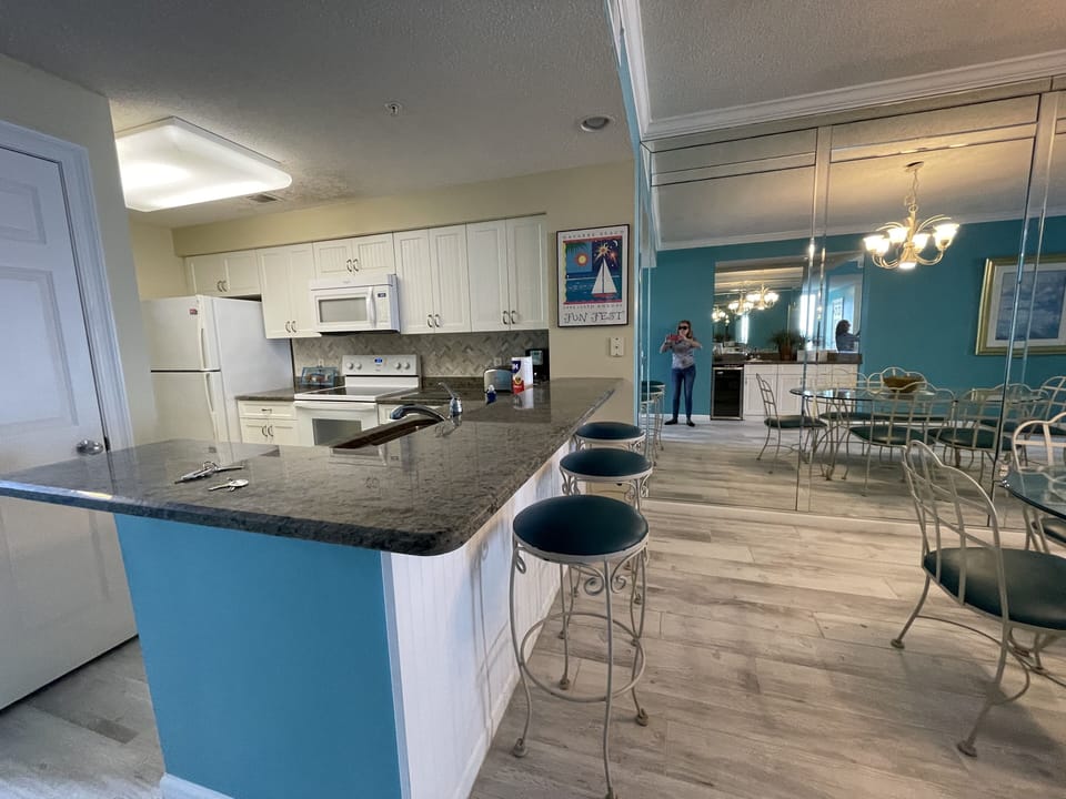 Large breakfast bar provides additional seating & is open to the Dining area.