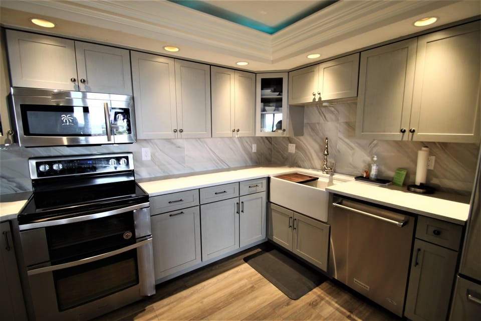 double oven, microwave, farmer sink, dishwasher.