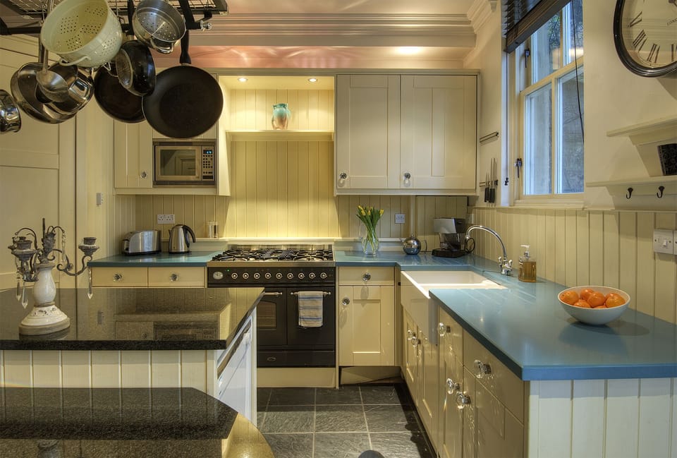 The kitchen with the range oven and stove