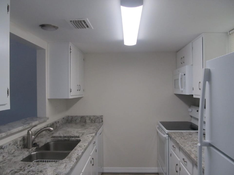 Galley Kitchen with new Granite Counter Tops.