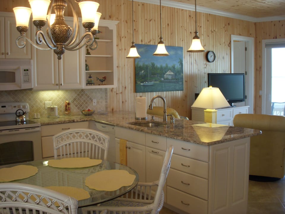 The efficient gourmet kitchen makes cooking/cleanup a pleasure - with ocean view