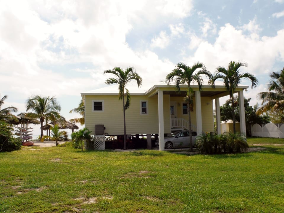 This is the street side of Kokomo, the Tiki Hut and kayak/paddleboard rack.
