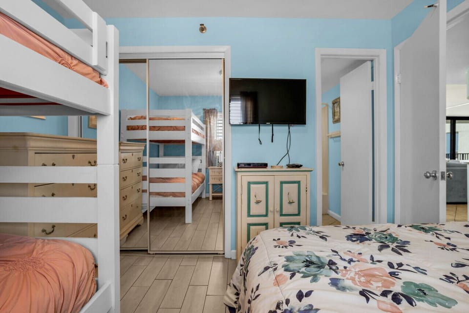 Guest bedroom with flat screen TV.