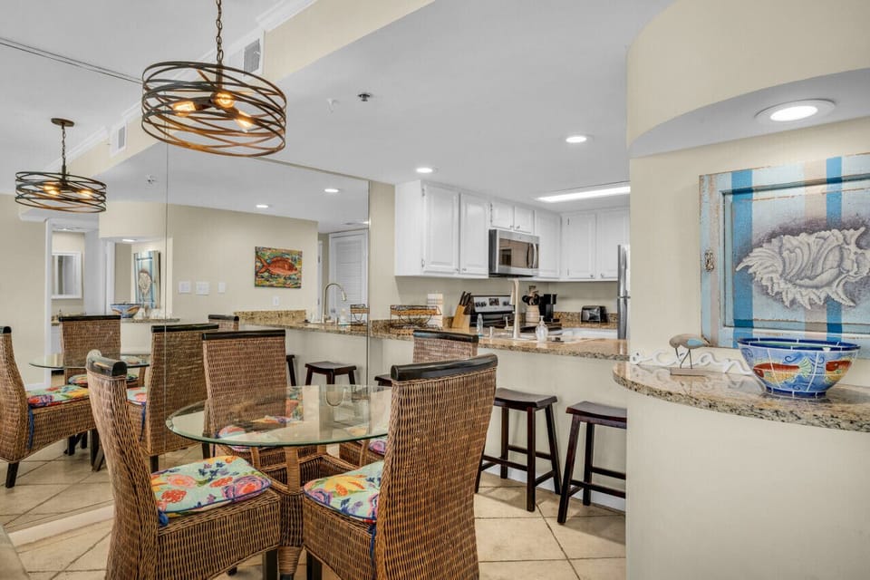 Dining table that seats 4 with additional counter seating.